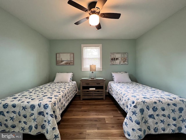 bedroom with ceiling fan and hardwood / wood-style floors