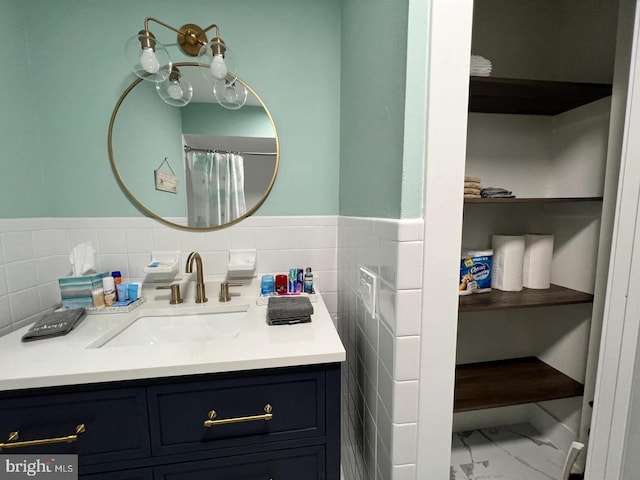 bathroom featuring backsplash, tile patterned flooring, and vanity