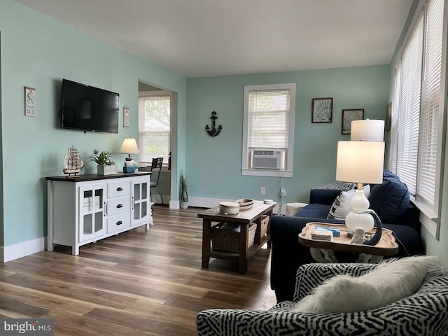 living room with dark hardwood / wood-style floors and cooling unit