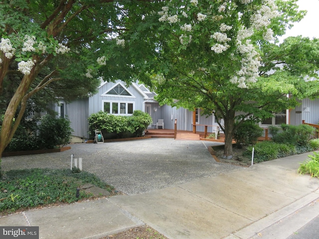 130 Mcfee St, Lewes, DE 19958 - view of front of house with board and batten siding and a porch