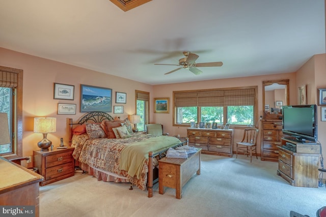 carpeted bedroom with ceiling fan