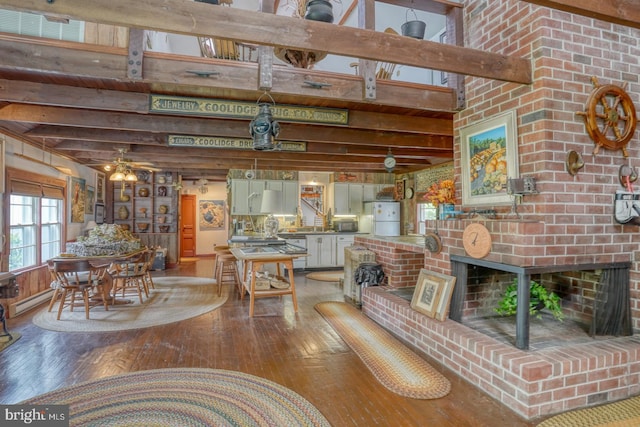 130 Mcfee St, Lewes, DE 19958 - living room with hardwood / wood-style flooring, beam ceiling, and a fireplace