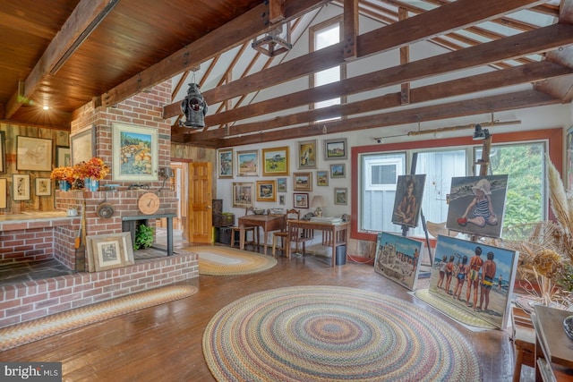 living room with hardwood / wood-style floors, beamed ceiling, wood ceiling, and high vaulted ceiling