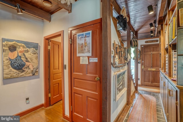 130 Mcfee St, Lewes, DE 19958 - hallway with wooden ceiling with exposed beams, baseboards, and wood finished floors