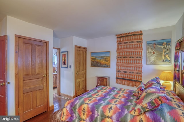 bedroom with hardwood / wood-style floors