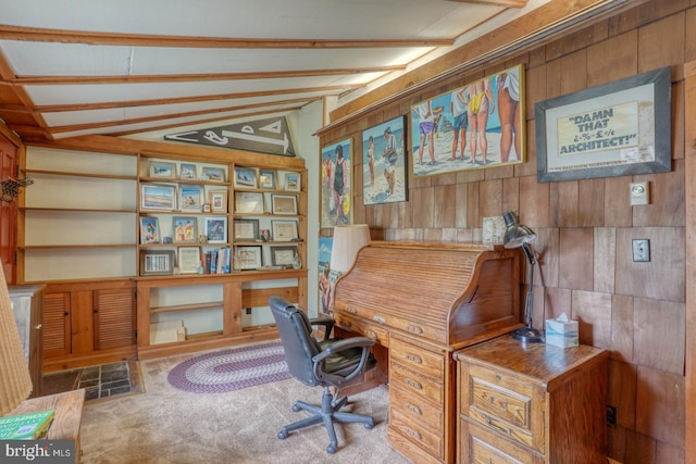 carpeted office space featuring lofted ceiling with beams, wood walls, and built in features