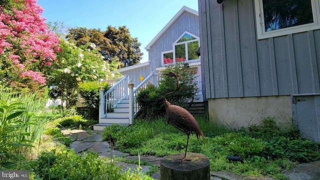 130 Mcfee St, Lewes, DE 19958 - view of side of property with stairs and board and batten siding