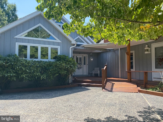 view of front of property with a wooden deck