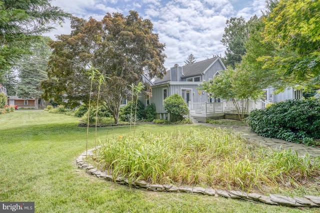 130 Mcfee St, Lewes, DE 19958 - view of grassy yard featuring a wooden deck