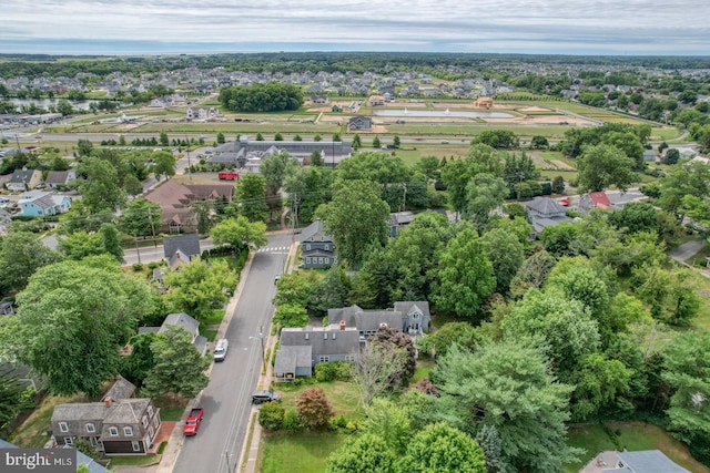 130 Mcfee St, Lewes, DE 19958 - aerial view of property's location featuring nearby suburban area and a tree filled landscape