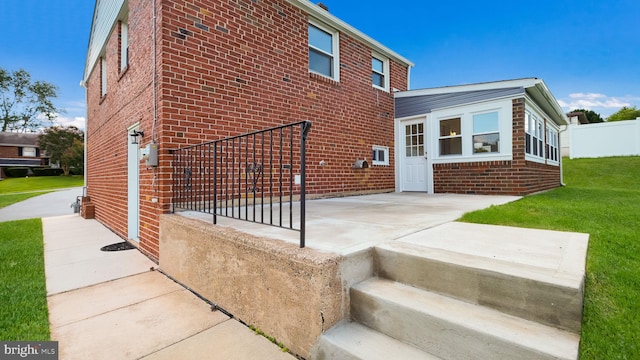 exterior space with a yard and a patio