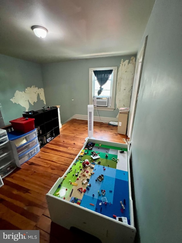 playroom with wood-type flooring and cooling unit