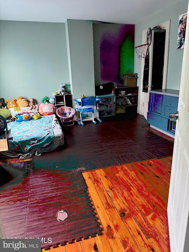 bedroom featuring hardwood / wood-style flooring