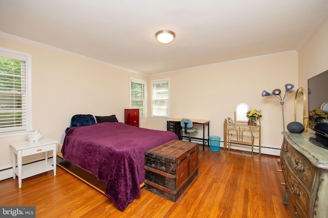 bedroom featuring wood-type flooring, ornamental molding, and baseboard heating