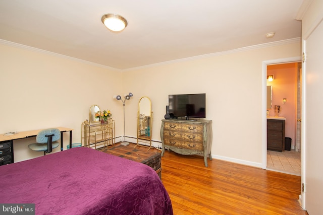 bedroom featuring tile patterned flooring, ensuite bath, and crown molding