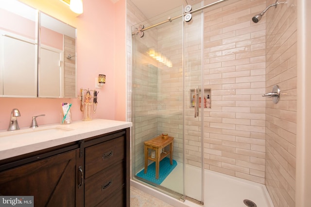 bathroom featuring walk in shower and vanity