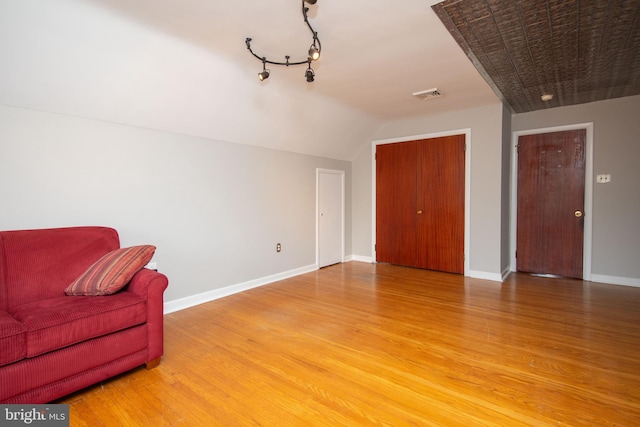 living area with hardwood / wood-style flooring