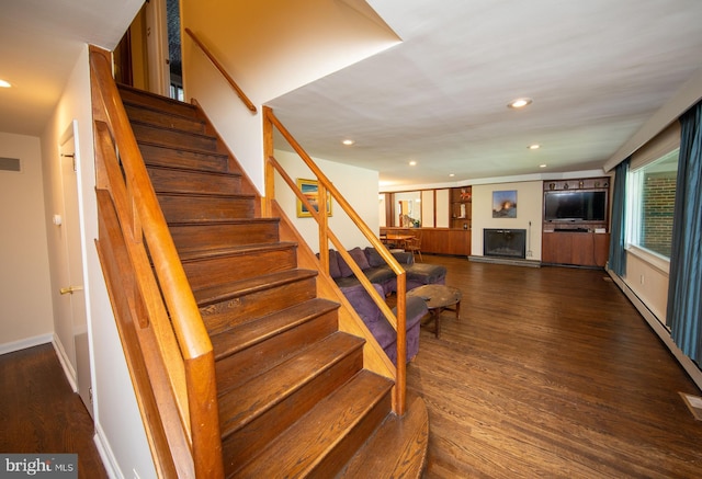 stairs featuring hardwood / wood-style flooring