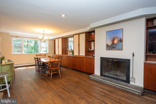 dining area with dark hardwood / wood-style floors, baseboard heating, and a chandelier