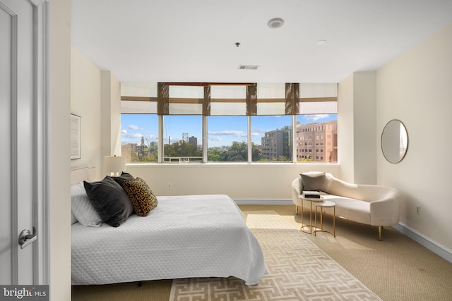 bedroom with light colored carpet