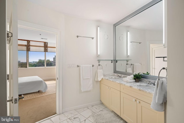 bathroom with dual bowl vanity and tile patterned floors