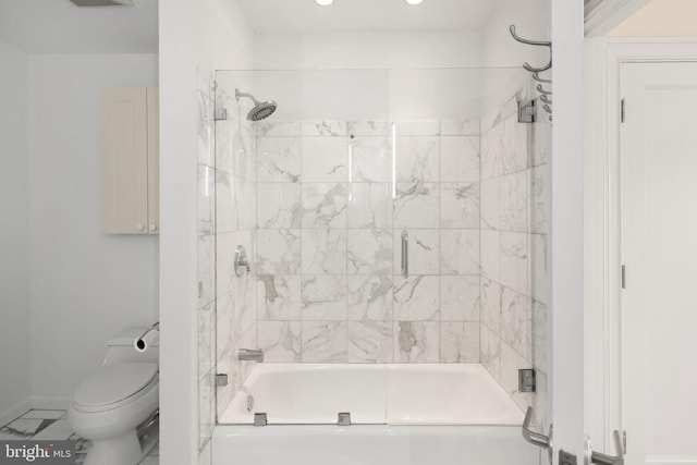 bathroom featuring enclosed tub / shower combo, tile patterned flooring, and toilet