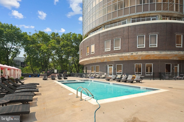 view of swimming pool with a patio area