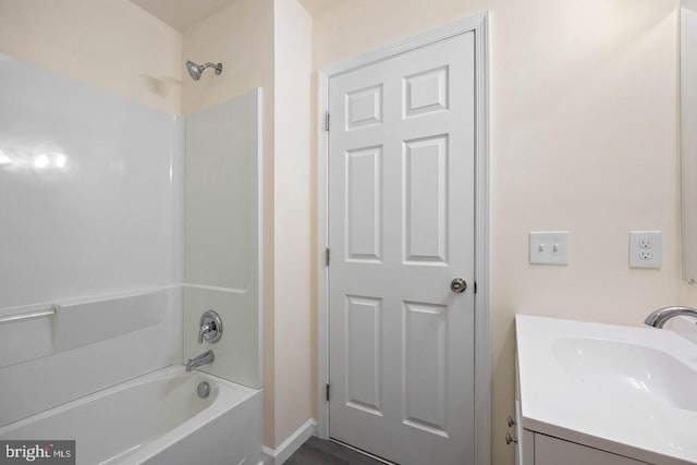 bathroom with shower / bathing tub combination and vanity