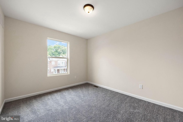 unfurnished room featuring carpet flooring