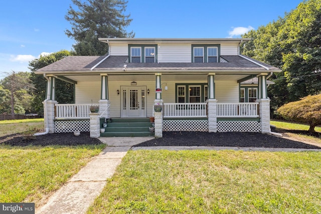 view of front facade with a porch and a front yard