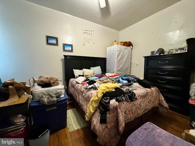 bedroom with ceiling fan and wood-type flooring