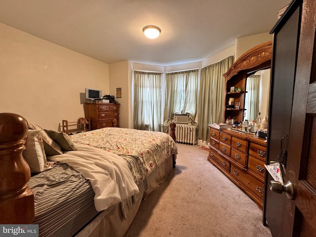 carpeted bedroom featuring radiator heating unit