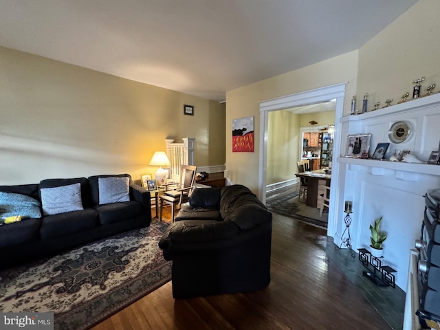 living room with dark hardwood / wood-style floors