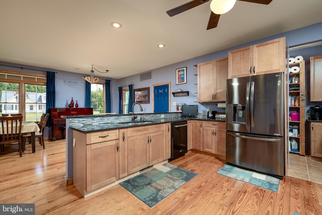 kitchen with black dishwasher, stainless steel refrigerator with ice dispenser, light wood-type flooring, kitchen peninsula, and ceiling fan