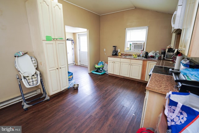 kitchen with cooling unit, lofted ceiling, dark hardwood / wood-style flooring, and stove