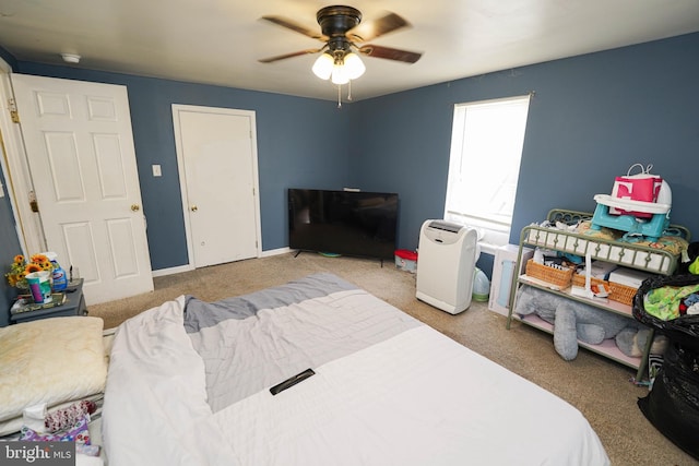 bedroom featuring ceiling fan and light colored carpet