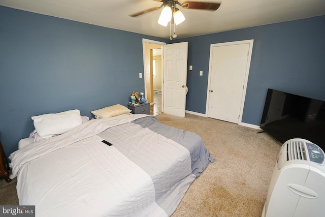 bedroom with ceiling fan and carpet