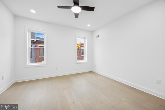 spare room featuring recessed lighting, visible vents, baseboards, and light wood-style flooring