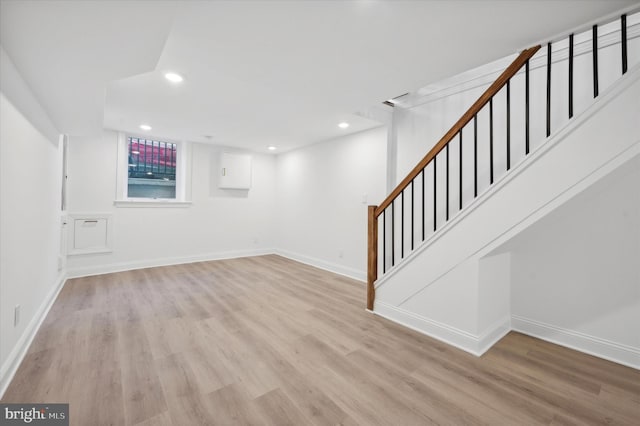 basement featuring light hardwood / wood-style floors