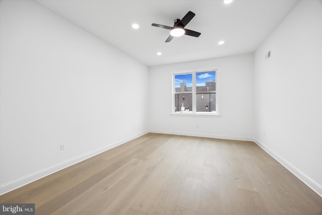 empty room featuring baseboards, recessed lighting, visible vents, and light wood-type flooring