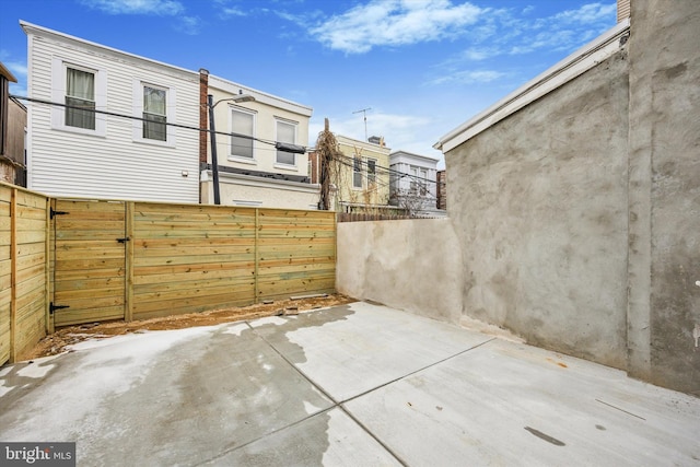 view of patio / terrace featuring fence