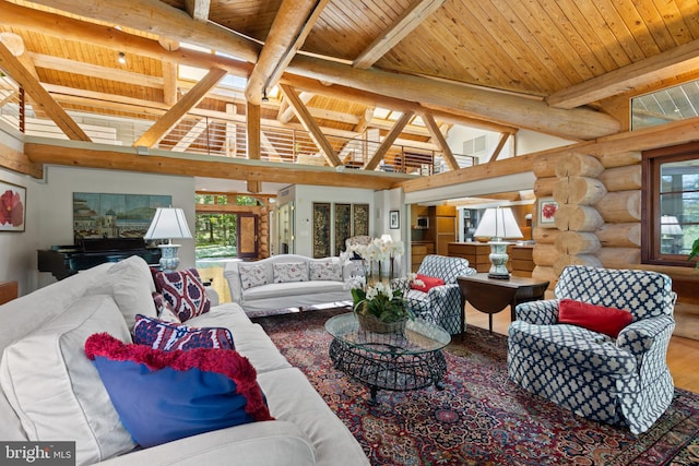 living room featuring a wealth of natural light, rustic walls, wood finished floors, and wood ceiling