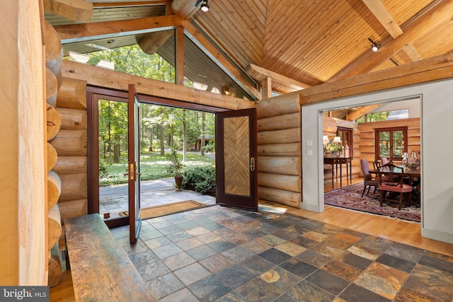 interior space featuring wood ceiling, high vaulted ceiling, beamed ceiling, and rail lighting