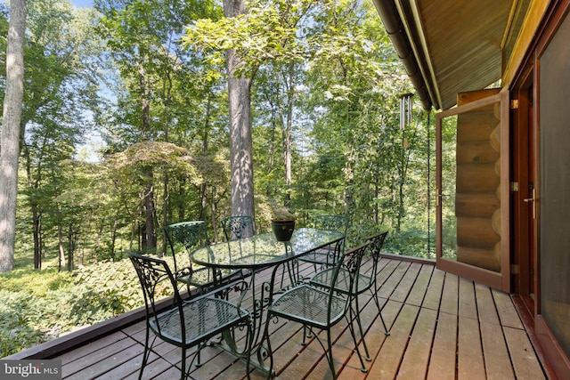 wooden deck with outdoor dining area