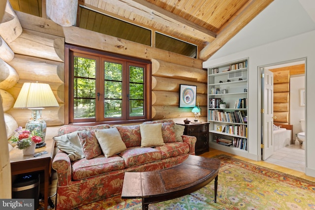 living area with rustic walls, wooden ceiling, and lofted ceiling with beams