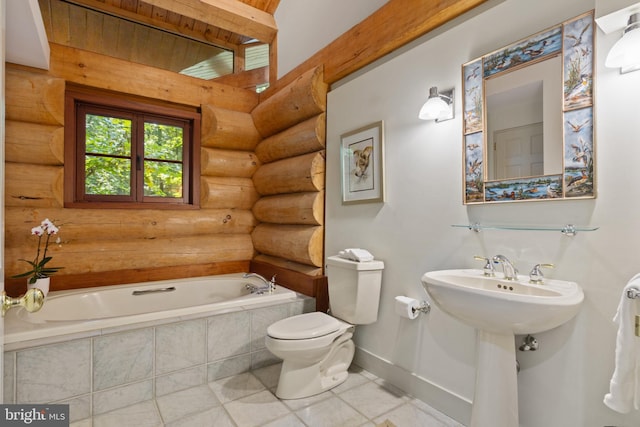 bathroom featuring a garden tub, toilet, tile patterned floors, log walls, and baseboards