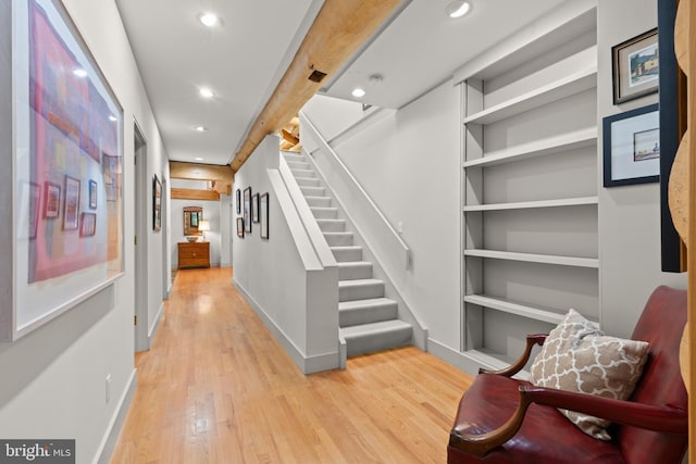 interior space with light wood-style floors, recessed lighting, baseboards, and stairs