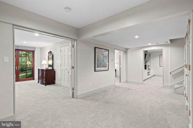 interior space featuring recessed lighting, carpet flooring, and baseboards
