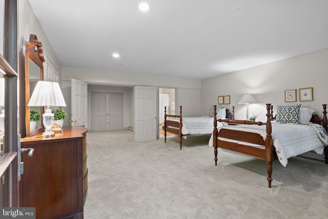 bedroom featuring light carpet and recessed lighting