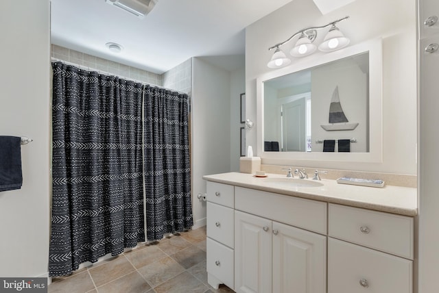 bathroom featuring vanity and a shower with curtain